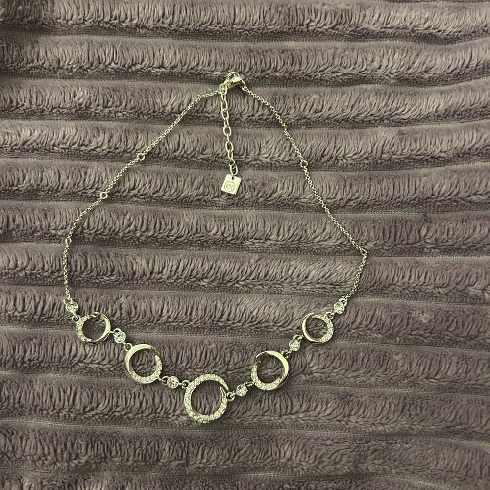 Elegant Silver Toned Necklace with Circular Accents
